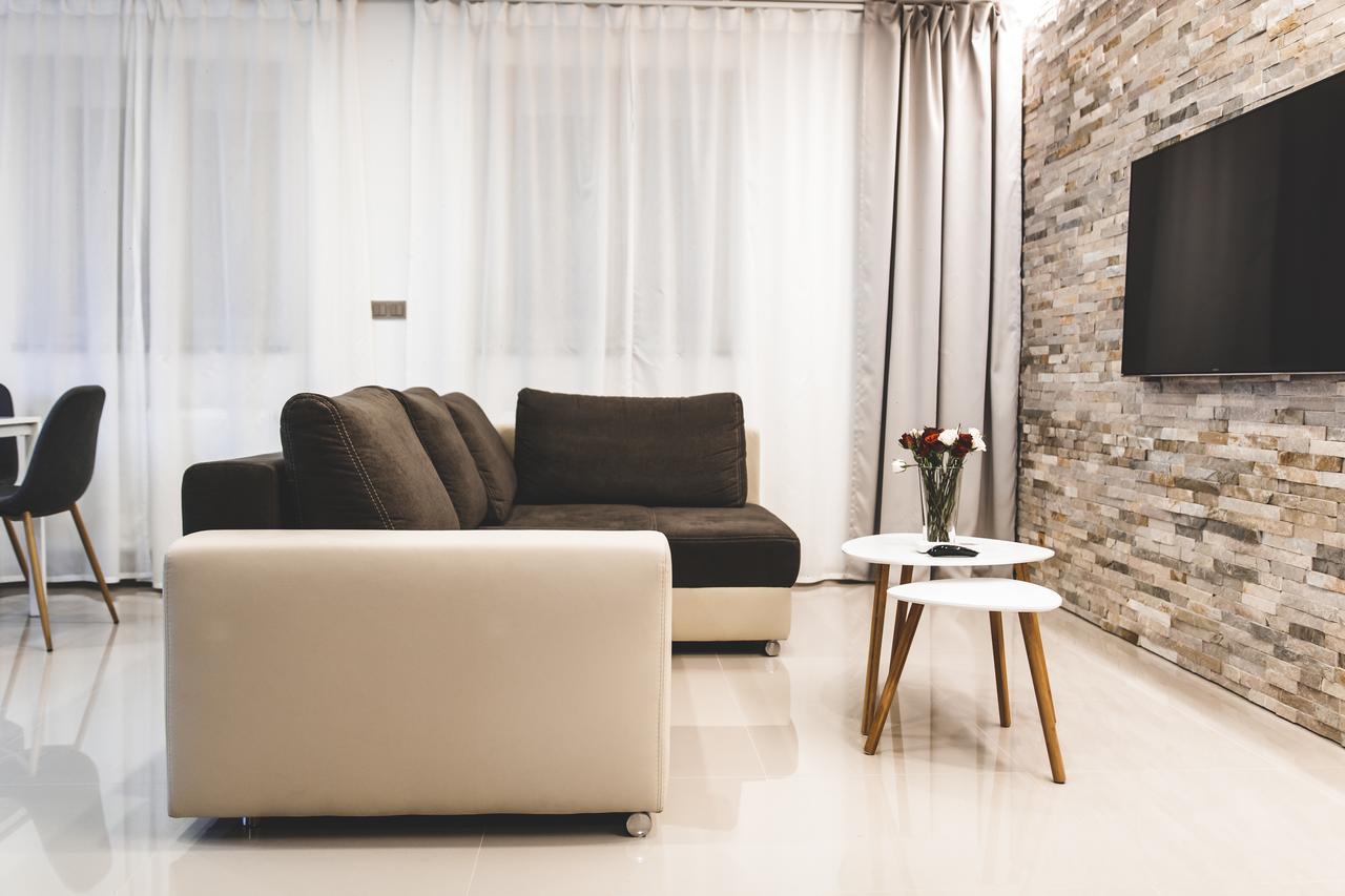 Silesia Residence Ostrava Exterior photo A living room with a flat screen television