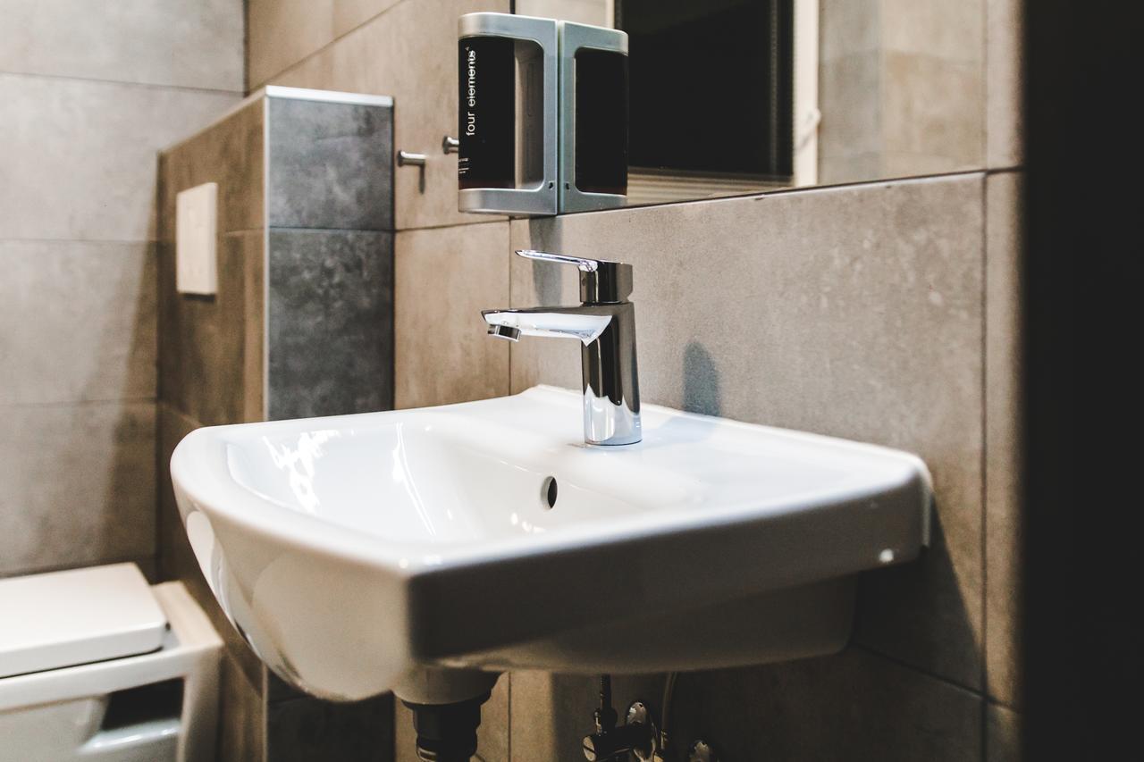 Silesia Residence Ostrava Exterior photo A soap dispenser mounted above a sink
